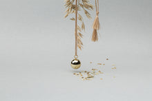 Load image into Gallery viewer, Maternity necklace / pregnancy necklace / harmony ball / bola  Baby lovey / Baby comforter Composition : pendant in 18 carat gold-tone brass, silver or 18 carat  rose gold-tone brass, cord and tassels in fair trade silk Measurements : pendant diameter: 20mm, cord length: 1100 mm