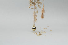 Load image into Gallery viewer, Maternity necklace / pregnancy necklace / harmony ball / bola  Baby lovey / Baby comforter Composition : pendant in 18 carat gold-tone brass, silver or 18 carat  rose gold-tone brass, cord and tassels in fair trade silk Measurements : pendant diameter: 20mm, cord length: 1100 mm
